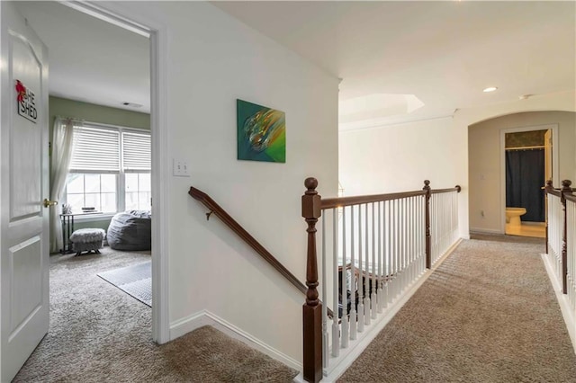 3780 Summit Gate Dr, Suwanee, GA 30024 - corridor featuring carpet floors, an upstairs landing, baseboards, arched walkways, and recessed lighting