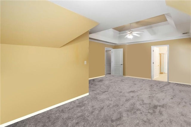 3780 Summit Gate Dr, Suwanee, GA 30024 - unfurnished bedroom featuring a tray ceiling, baseboards, carpet flooring, ensuite bath, and a ceiling fan
