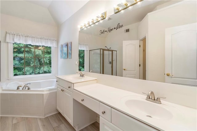 3780 Summit Gate Dr, Suwanee, GA 30024 - bathroom featuring a stall shower, double vanity, a bath, and lofted ceiling