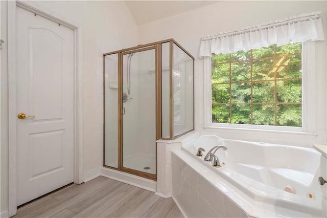 3780 Summit Gate Dr, Suwanee, GA 30024 - bathroom with a shower stall, healthy amount of natural light, a tub with jets, and wood finished floors