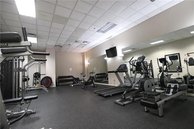 workout area with a drop ceiling