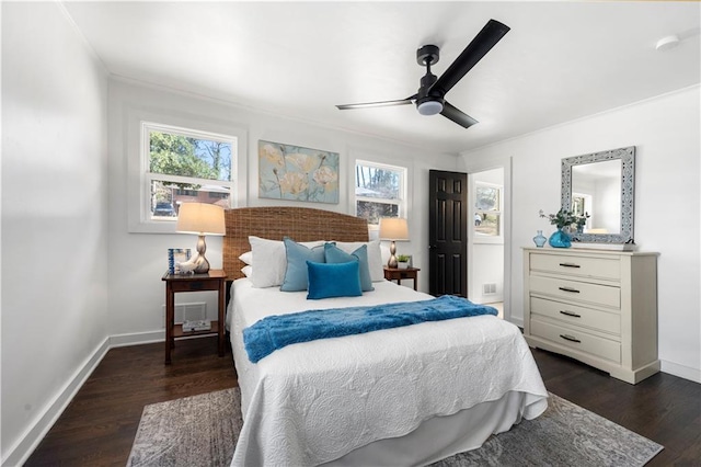 bedroom with dark wood-type flooring, ceiling fan, ornamental molding, and multiple windows