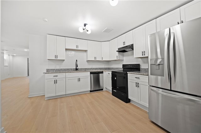 kitchen featuring appliances with stainless steel finishes, light hardwood / wood-style floors, sink, and white cabinets