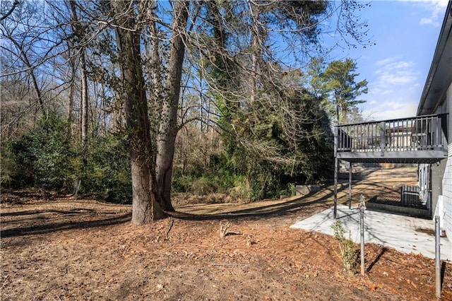 view of yard featuring a wooden deck