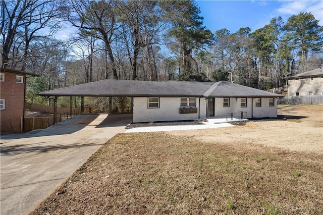 single story home featuring a carport and a front yard