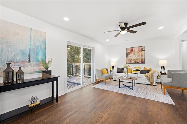 living room with a ceiling fan, recessed lighting, and wood finished floors