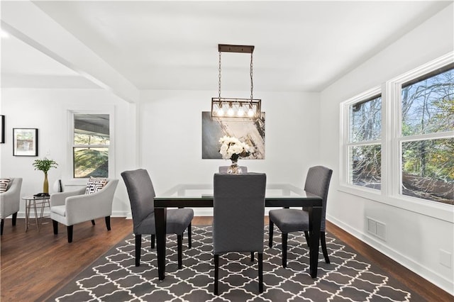 dining area with dark wood-type flooring