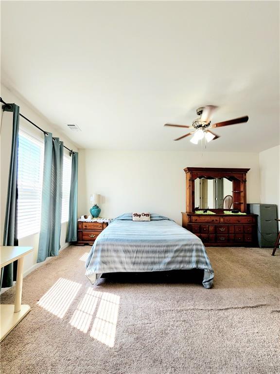 bedroom with carpet flooring and ceiling fan