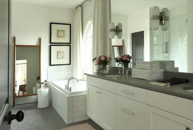 2067 Telfair Cir Unit A & B, Atlanta, GA 30324 - bathroom with double vanity, a bath, and tile patterned floors