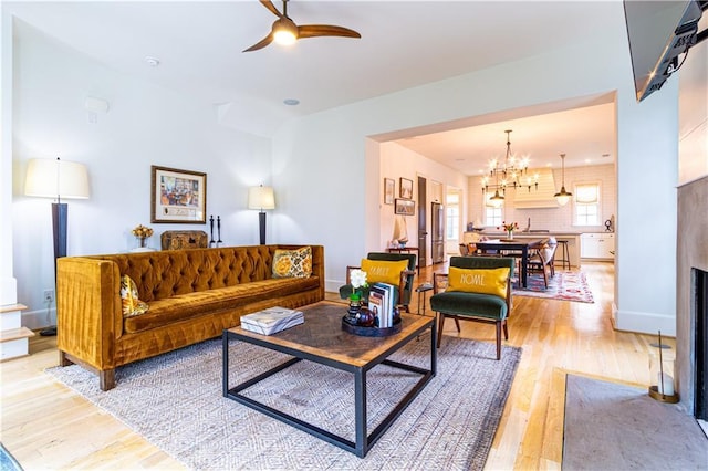 2067 Telfair Cir Unit A & B, Atlanta, GA 30324 - living area with light wood-style flooring, a ceiling fan, a chandelier, and baseboards