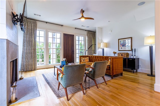 2067 Telfair Cir Unit A & B, Atlanta, GA 30324 - living area featuring ceiling fan, light wood-style flooring, a fireplace, and baseboards