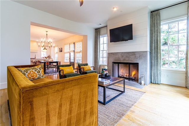 2067 Telfair Cir Unit A & B, Atlanta, GA 30324 - living room with a fireplace, light wood-style flooring, and a chandelier