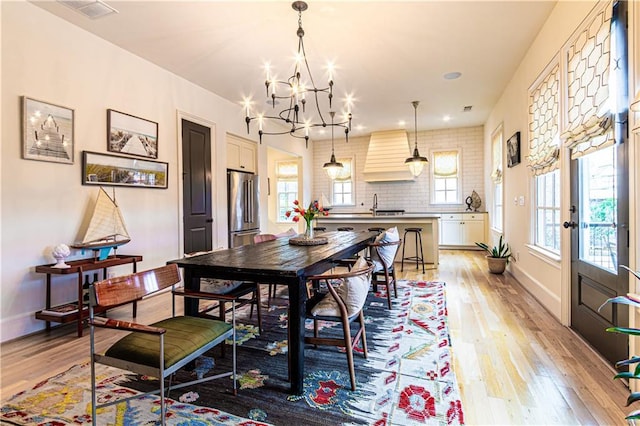2067 Telfair Cir Unit A & B, Atlanta, GA 30324 - dining room featuring a chandelier, light wood-type flooring, baseboards, and recessed lighting