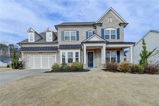 view of front of property with a porch and a garage