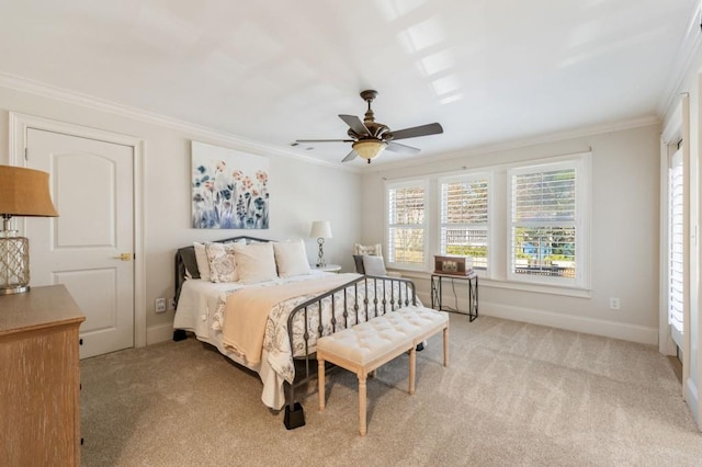 bedroom with ceiling fan, ornamental molding, and light colored carpet