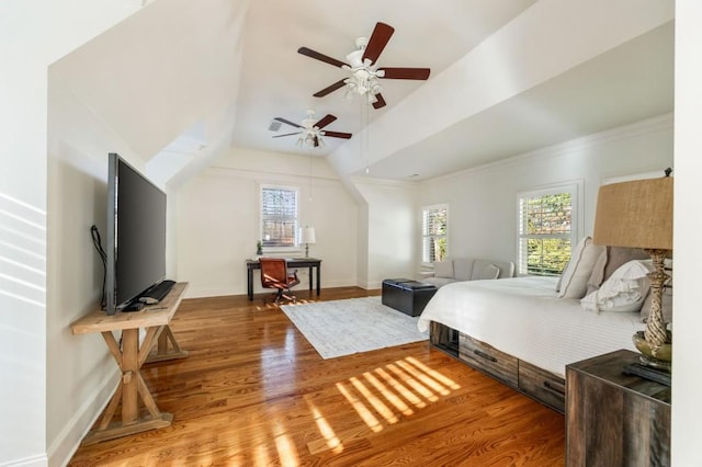 bedroom featuring wood-type flooring, vaulted ceiling, and ceiling fan