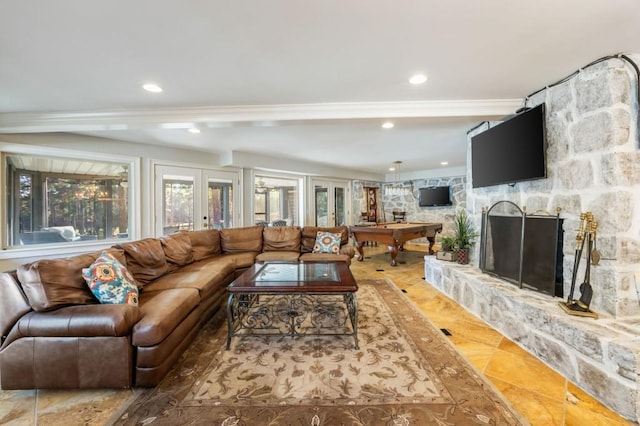 living room featuring french doors and a fireplace