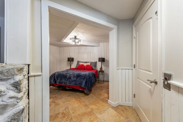 bedroom with wooden walls