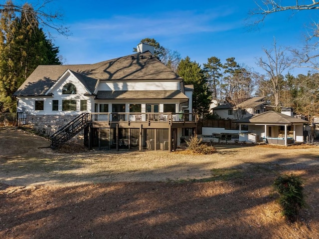 rear view of house with a deck