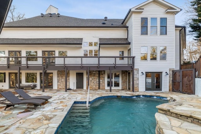 back of property featuring a patio and french doors