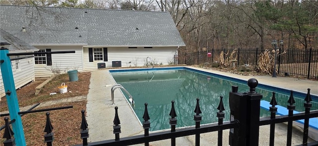 view of swimming pool featuring a fenced in pool and fence