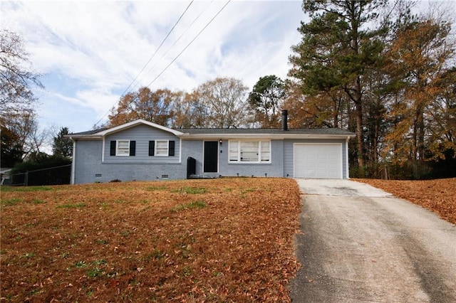 single story home featuring a garage