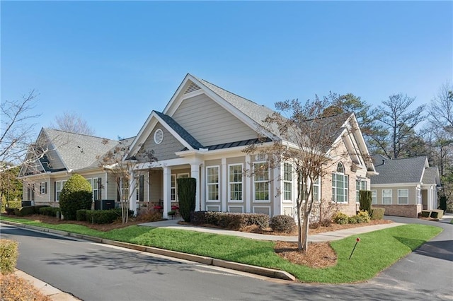 craftsman inspired home with a pergola and a front yard