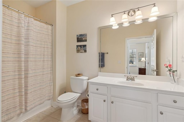 full bathroom featuring tile patterned flooring, vanity, toilet, and shower / bathtub combination with curtain