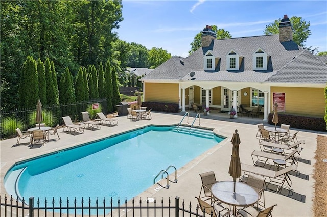 view of swimming pool with a patio