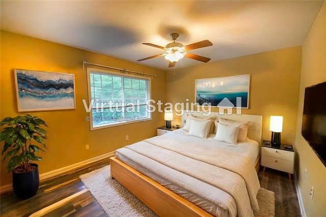 bedroom featuring dark hardwood / wood-style floors and ceiling fan