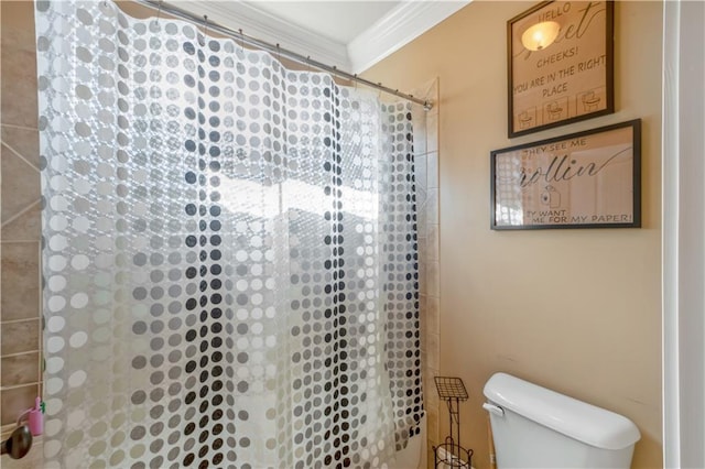 bathroom with ornamental molding, a shower with shower curtain, and toilet