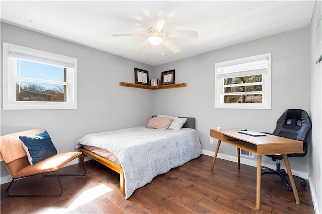 bedroom featuring ceiling fan, wood finished floors, and baseboards