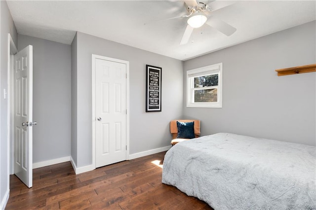 bedroom featuring wood-type flooring, baseboards, and a ceiling fan