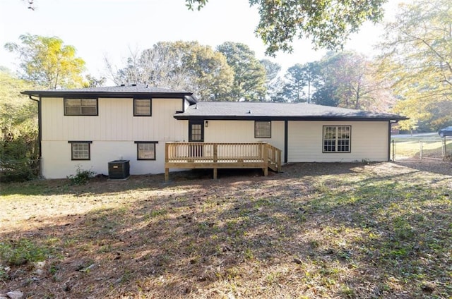 rear view of house with a deck and central AC unit