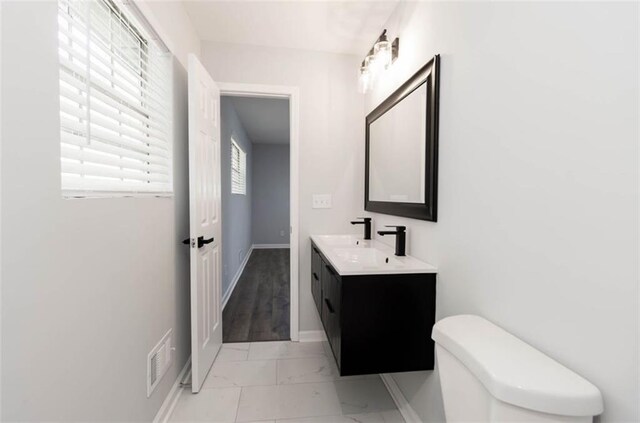 bathroom with vanity and toilet