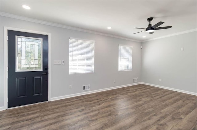 entryway featuring dark hardwood / wood-style flooring, ornamental molding, and ceiling fan