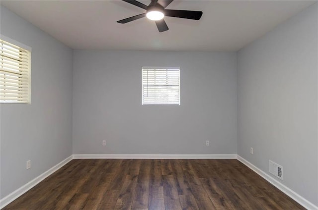 unfurnished room featuring ceiling fan and dark hardwood / wood-style flooring