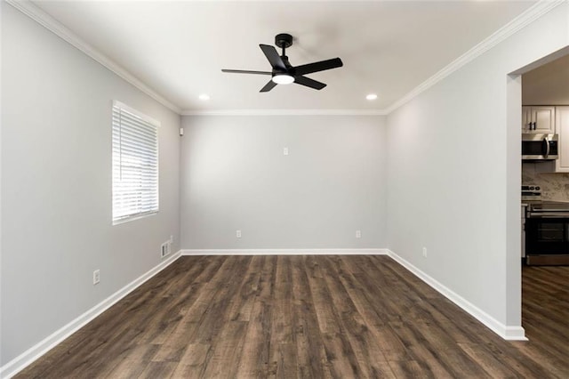 spare room with dark wood-type flooring, ceiling fan, and crown molding