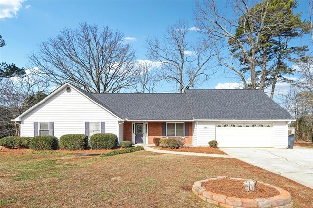 ranch-style home with a garage and a front lawn