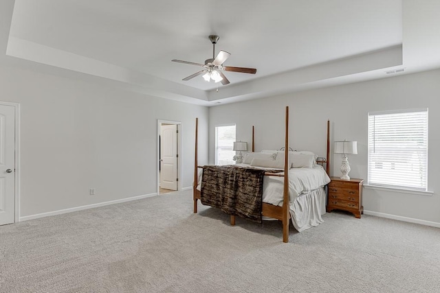 862 Blind Brook Cir, Hoschton, GA 30548 - bedroom with a raised ceiling, light carpet, baseboards, and ceiling fan