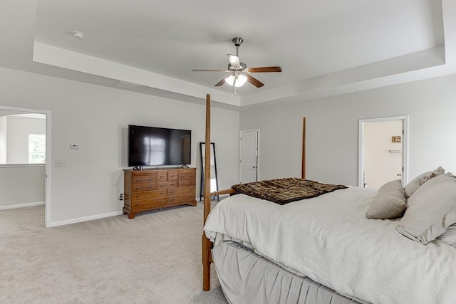 862 Blind Brook Cir, Hoschton, GA 30548 - bedroom featuring a raised ceiling, baseboards, light carpet, and a ceiling fan