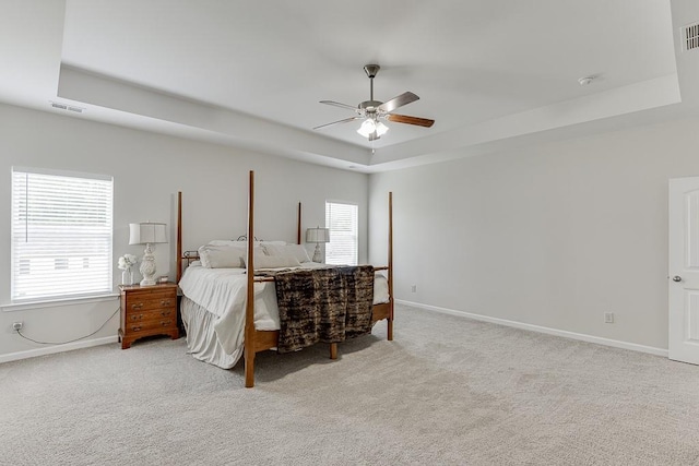 862 Blind Brook Cir, Hoschton, GA 30548 - bedroom with a tray ceiling, light colored carpet, and baseboards