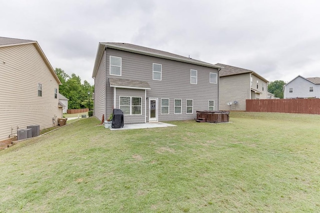 862 Blind Brook Cir, Hoschton, GA 30548 - rear view of property featuring a hot tub, a patio area, and central AC unit
