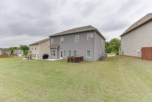 862 Blind Brook Cir, Hoschton, GA 30548 - rear view of property with a hot tub, a patio area, central AC, and a yard