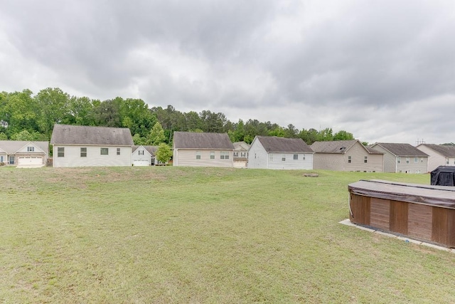 862 Blind Brook Cir, Hoschton, GA 30548 - view of grassy yard with a hot tub and a residential view