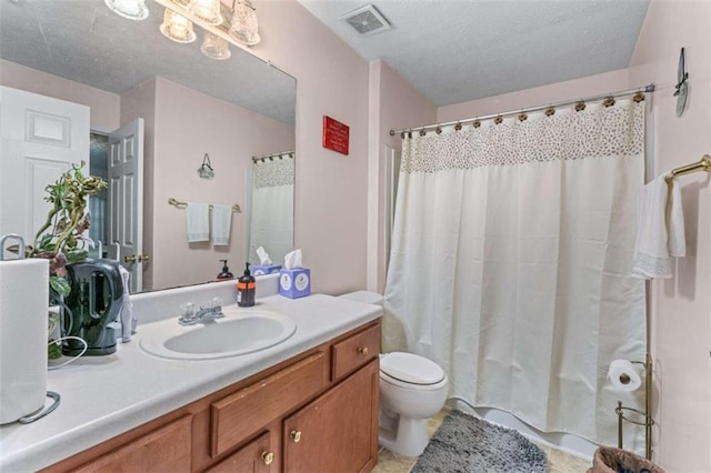 full bathroom with vanity, toilet, visible vents, and a textured ceiling