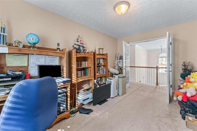 office with carpet floors and a textured ceiling