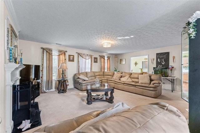 living room featuring a fireplace, carpet, visible vents, and a textured ceiling