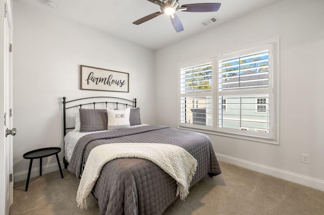 carpeted bedroom featuring ceiling fan