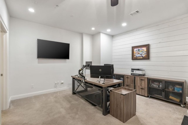 office space with light carpet and ceiling fan